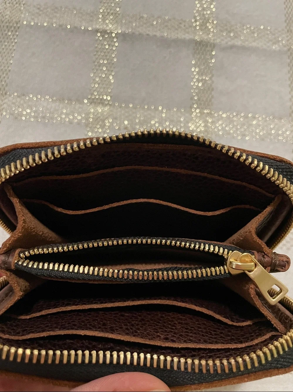 Portland Leather Goods brown wallet, gold tone zipper, inside holds coins/cards